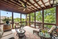 This wonderful screed patio has a special tin roof, trex decking, ceiling fan and grilling station just outside!