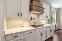 5 burner cooktop, new backsplash, instant hot water and decorative hood make this every chefs dream kitchen!!