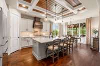 This stunning kitchen offers freshly painted island, new quartz countertops and backsplash, designer lighting, canned lighting and coffered ceiling, accented with shiplap inlay....