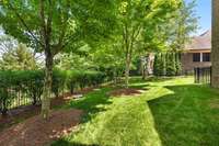 Professionally landscaped, mature trees and landscape lighting!