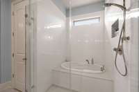 Complete with a tiled "wet room" with a soaking tub and shower head, along with a linen closet-