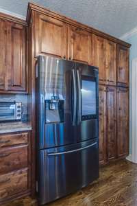 Equipped with a smart refrigerator, this kitchen allows for convenient access to recipes, grocery lists, and more.