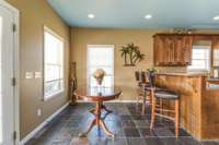 A cozy dining area complements the kitchen space.