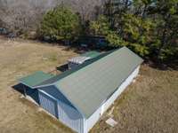 Charming country barn with attached shed, ideal for horse enthusiasts.