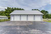 The fantastic 4-car oversized detached garage provides plenty of space for vehicles and storage needs.