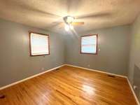 One of 3 bedrooms, all with "real" hardwood floors and ceiling fans