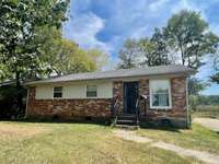 All Brick home on tree lined back yard. Dimensional shingles and replacement windows thru-out