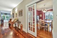 Solid slider doors into formal dining area.