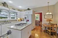 Eat-in kitchen with island that also provides additional storage and your gas cooktop range.