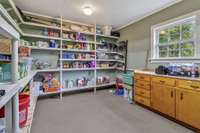 Large canning room and storage area off of your garage. Storage is plentiful.