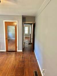 Looking down the hall to bedroom #2 and the bathroom