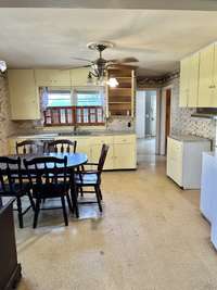 The living room flows smoothly into the dinning/kitchen area!!