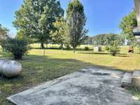 Concrete patio out the backdoor