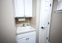 Utility sink and closet in the laundry room