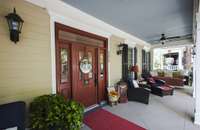 One of the most desired front porches in the neighborhood.  2 porch swings and chairs to greet your neighbors walking by.