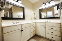 Master bath with lots of cabinets and counter space.  Double sinks