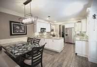 Large kitchen, built in bench with under seat storage.