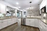 Great kitchen with significant cabinets and counter space that keeps going.  Walk in pantry for more storage.