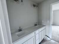 Jack & Jill bathroom with dual square under-mount sinks