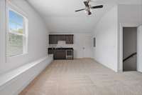 Wet bar with beverage refrigerator.