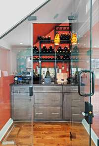 Climate controlled custom wine storage holds up to 84 standard bottles (7 cases) and 14 double magnum bottles.