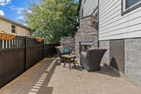 Cobblestone paver patio. Fenced yard. Gas fireplace.