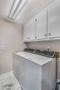 Laundry room on main level off kitchen.