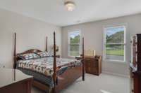 One of three bedrooms upstairs. So much light in this lovely home!