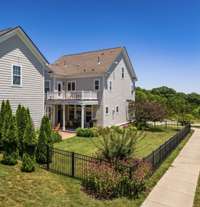 Rear view of 9556 Faulkner Square showing the fully fenced yard~Plenty of room for a playset, trampoline, volleyball net and/or private pool.