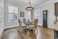 Informal dining area has french door to covered back patio.  Home office/drop zone is accessed via the cased opening on the right.