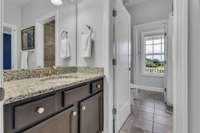 View of the shared bath to the second vanity area. Second vanity area opens directly from Bedroom 4.