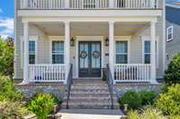 Covered front porch is the ideal spot to watch the beautiful sunrise. Abundant outdoor living spaces take advantage of the open space areas surrounding the house.  Views from both the upper balcony, lower front porch and back deck and rear patio!!!!