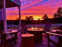 Imagine these sunset views from your back porch and private deck off the primary suite.