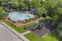 Playground is adjacent to the pool area.