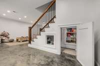 Full finished basement offers so many possibilities, including this fun hidden nook under the stairs.