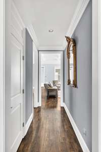 Hallway from the foyer to the den area off the kitchen.