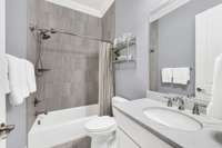 Hall bathroom for guests. Neutral walls and tile.