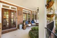 Inviting front porch with low maintenance iron railing