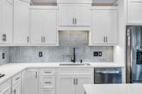 Kitchen with patterned tile backsplash