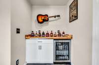 bar area with utility fridge