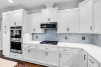 Remodeled kitchen with quartz countertops & stainless appliances (gas stove)