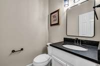 Guest bathroom with leathered granite countertop