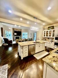 This lovely kitchen has it all.  Wolf double ovens, cooktop with  pot filler, subzero fridge,