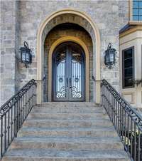 Gorgeous Stone home with a grand entrance.