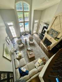 View of the cozy great room showing your pool just outside.