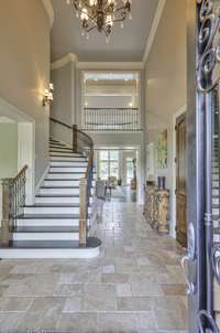 Just inside the beautiful door to this home you are welcomed by a grand staircase. Proms and weddings!!!