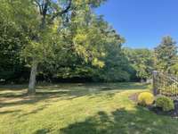 Very private and calm back yard backing up to all these beautiful trees.