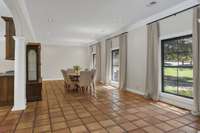 Open living space. Looking from foyer into dining room. Lots of natural light.