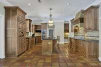 Custom walnut cabinetry with lots of space for entertaining.