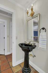 Powder room with access to pool area.